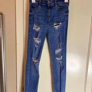 HIGH RISE RIPPED SKINNY JEANS